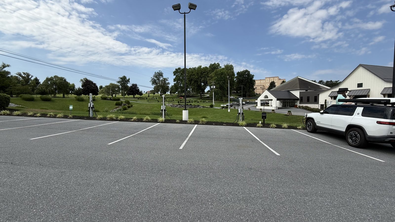A row of paid EV chargers at Hershey Farm Resort in Pennsylvania